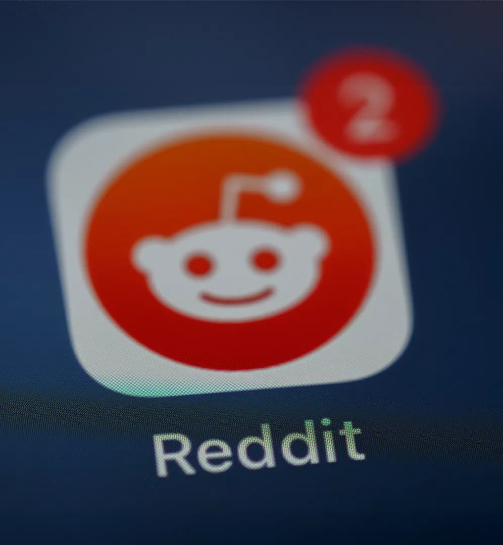 Reddit logo against an abstract background, symbolizing its upcoming IPO.