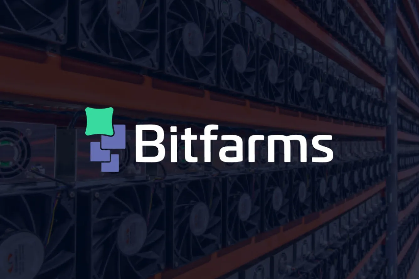 Bitfarms Bitcoin mining facility with mining rigs and company logo