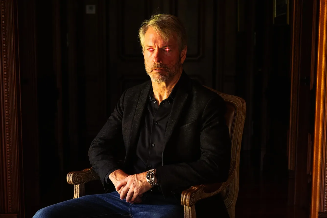 Michael Saylor, CEO of MicroStrategy, with Bitcoin logo — company buys additional 11,931 Bitcoins