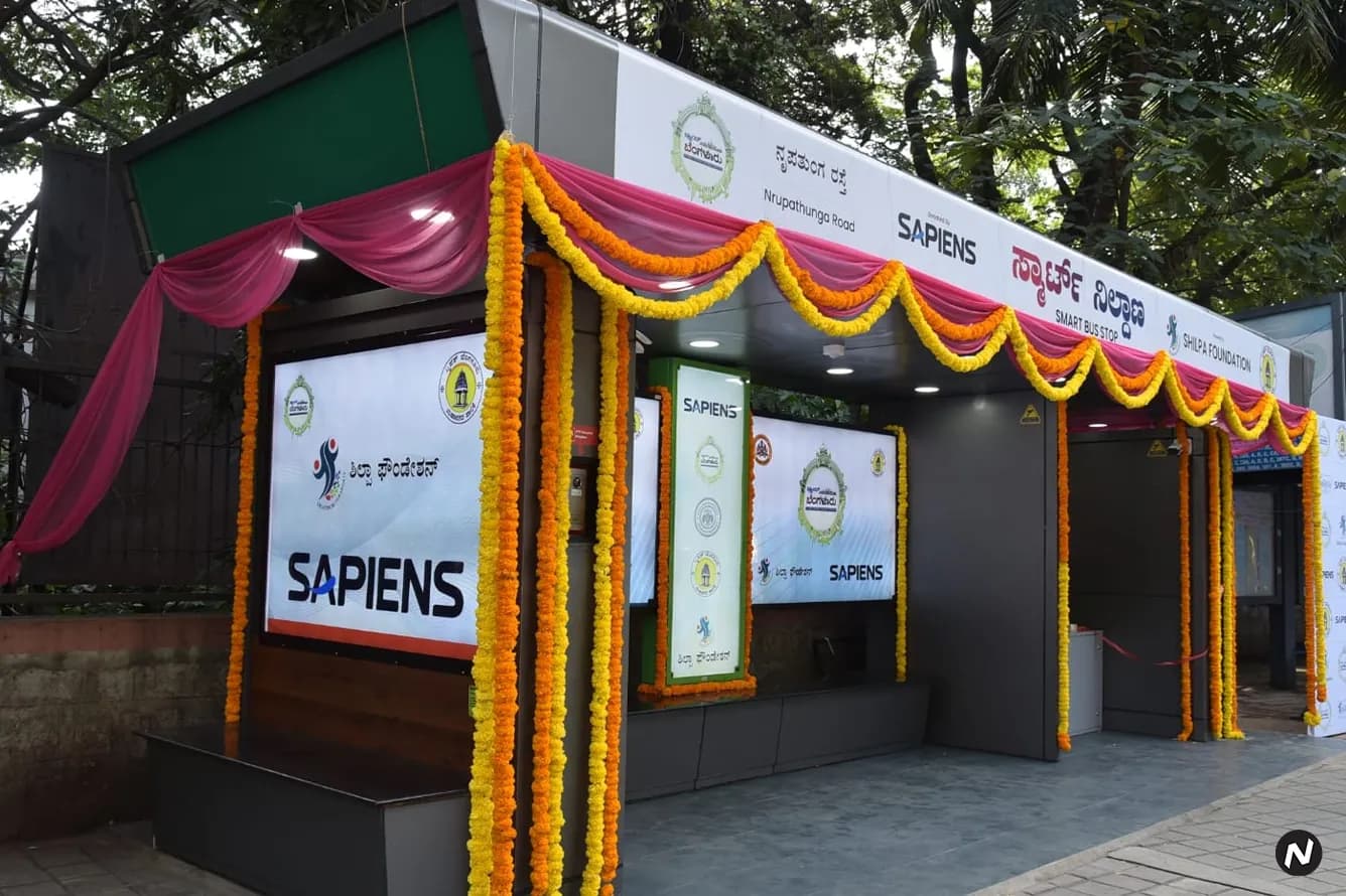 Elpro Energy smart bus stop at Nrupathunga Road, Bengaluru, featuring sanitary pad vending machine, AI camera, and panic butt